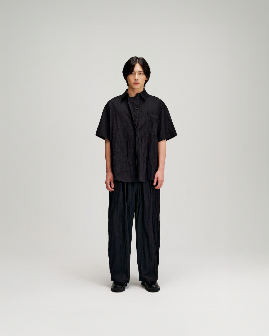 Gender Neutral Drape Neck Short-Sleeve Shirt (Black)