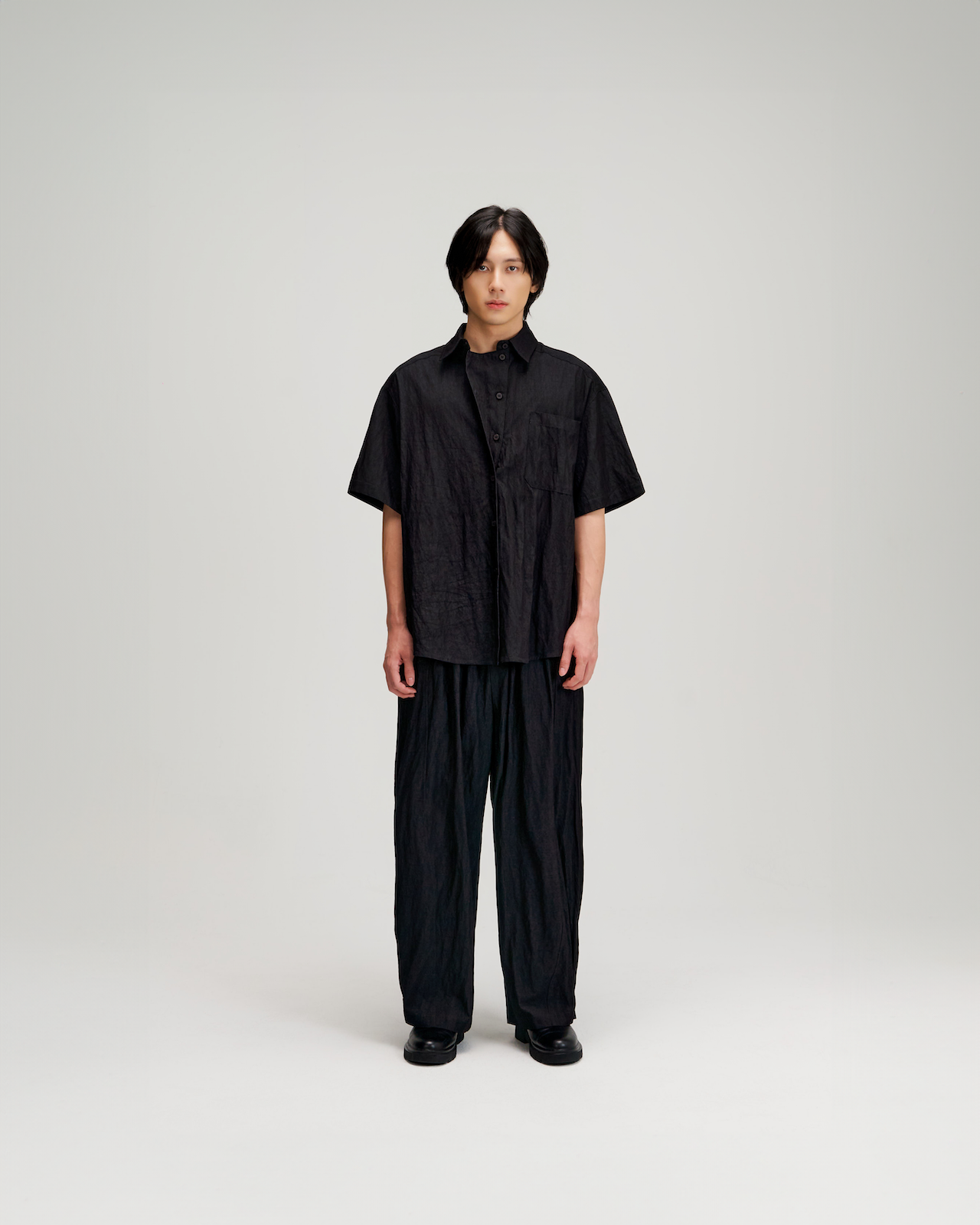 Gender Neutral Drape Neck Short-Sleeve Shirt (Black)