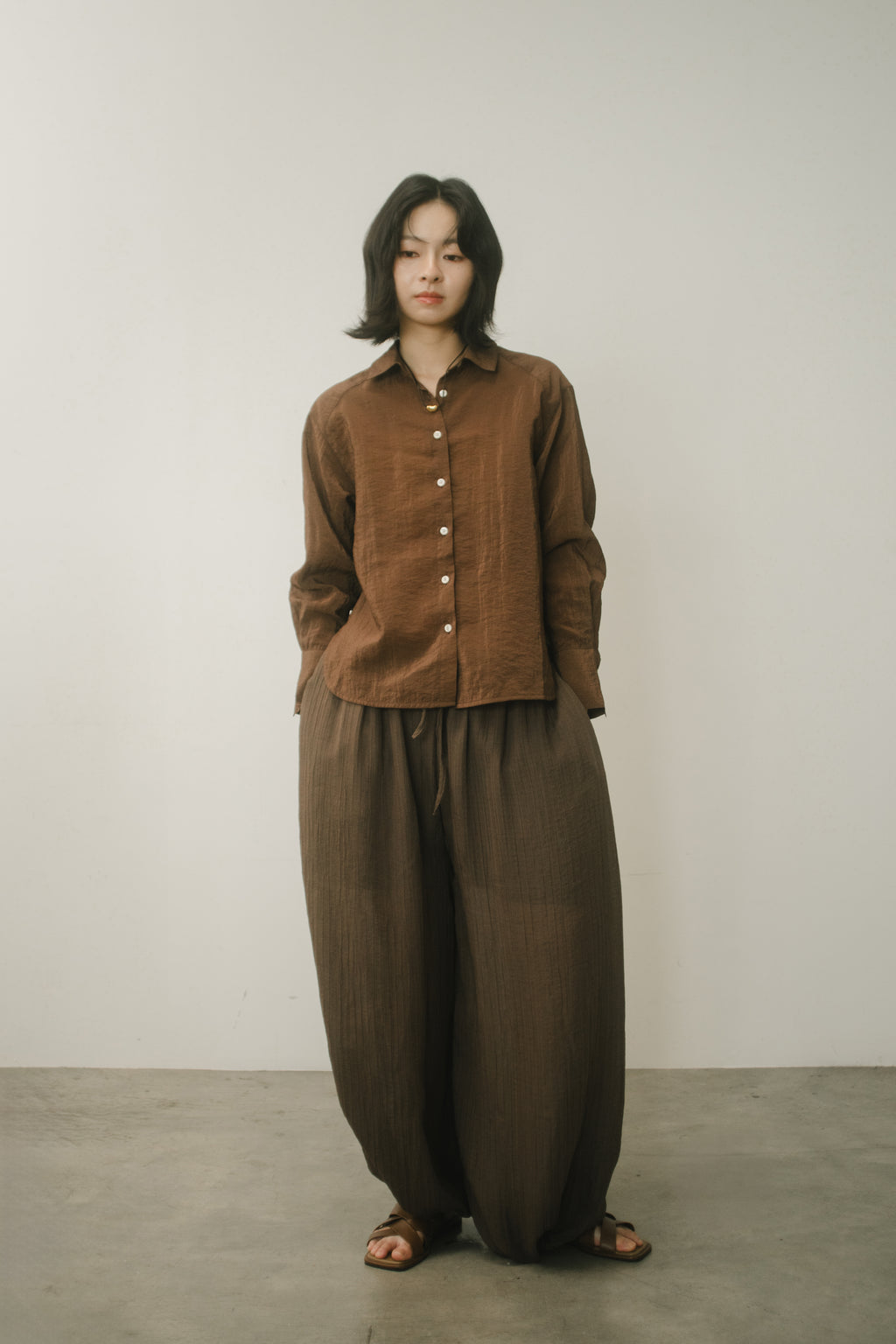 WES x GUNG x SO | Easy Shimmer U-Hem Blouse (Brown)
